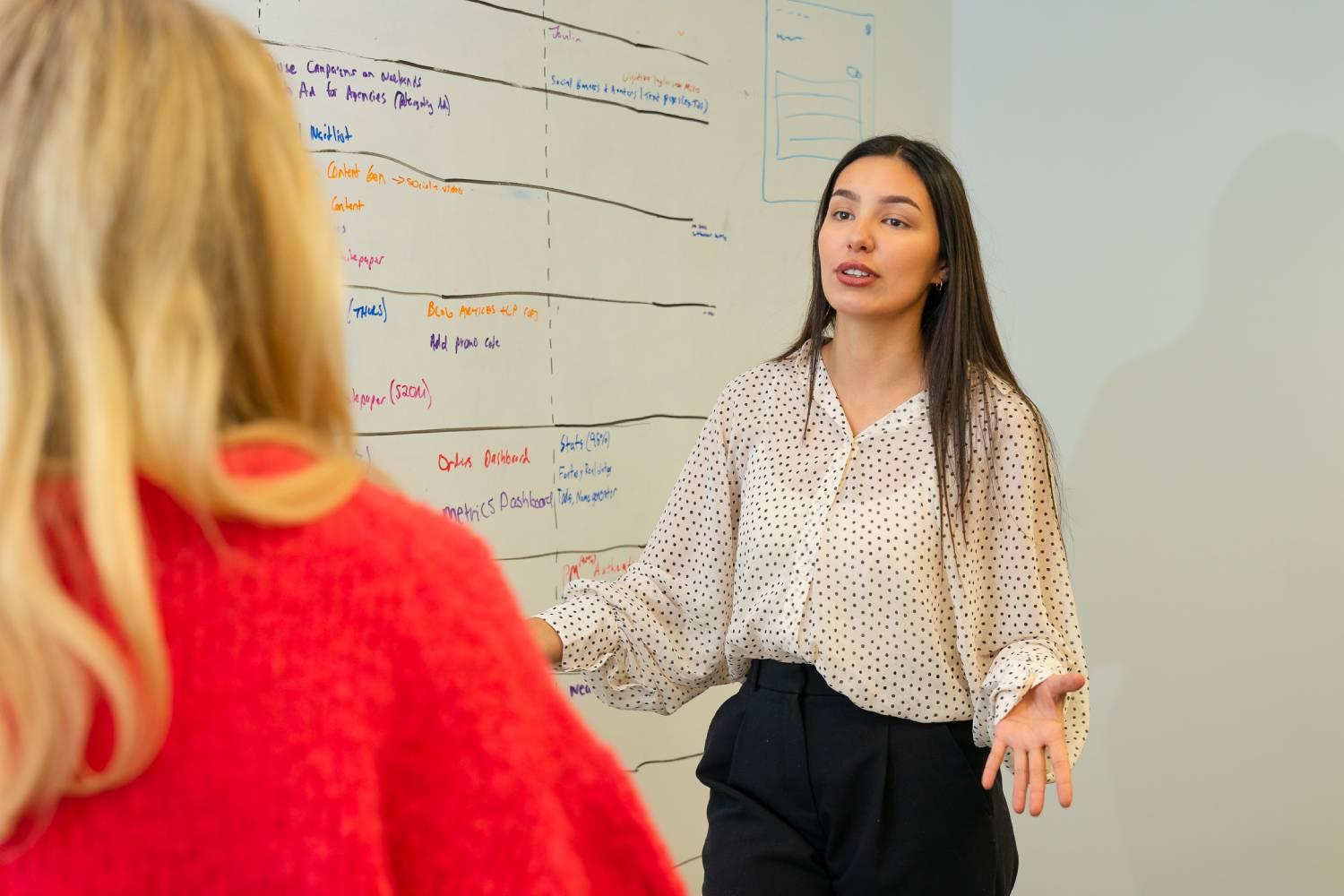 moonello-digital-marketing-strategy-whiteboard-two-female-team-members