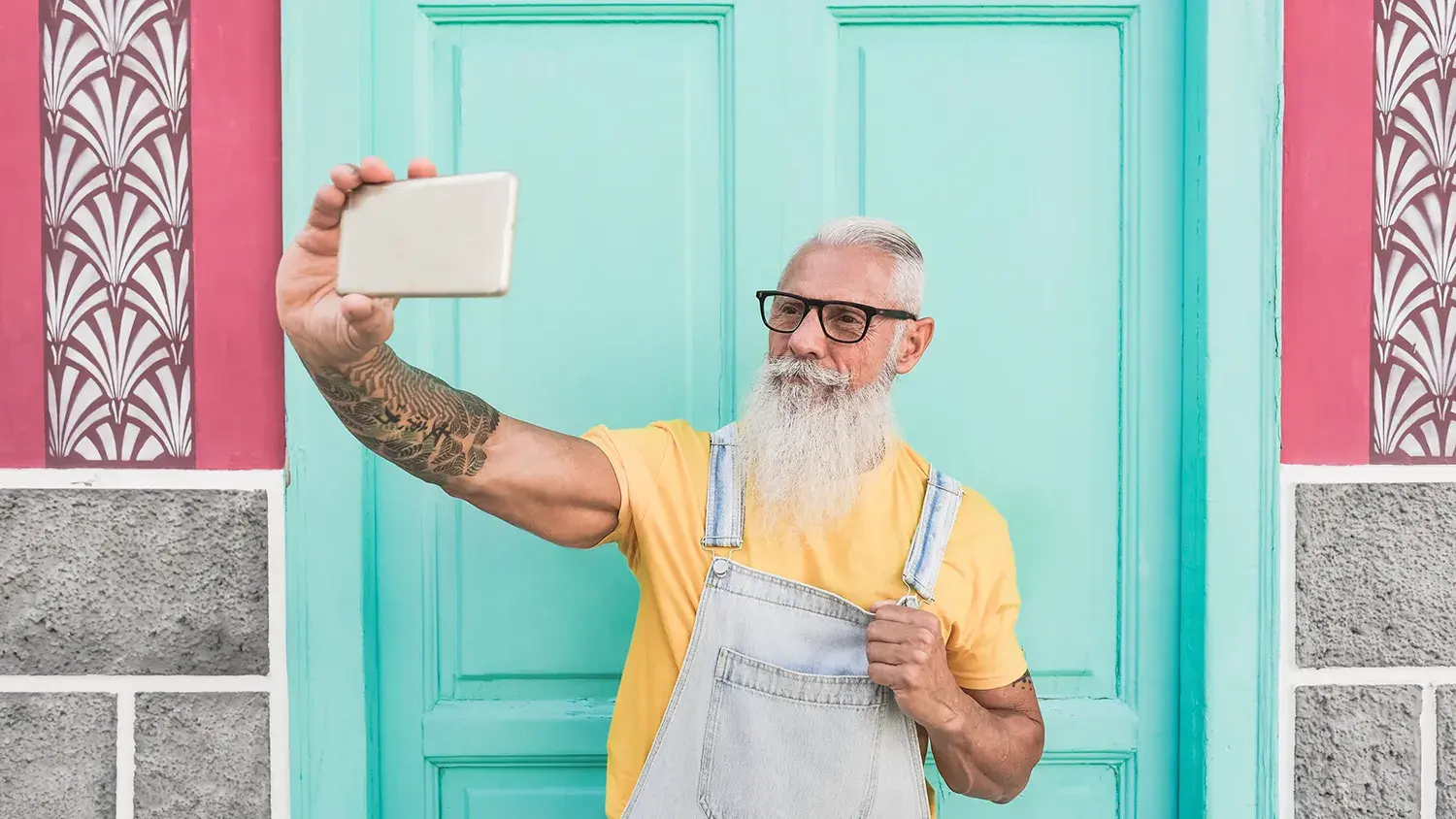 Trendy Senior Man Taking a Selfie Using a Mobile Phone